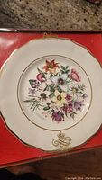 Full view of Palissy Canada collectible flower plate with original box