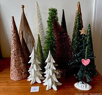 Image showing the full assortment of 14 assorted vintage Christmas trees in various colors and materials.