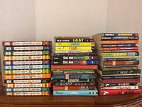 Photo showing the full collection of kids books including Diary of a Wimpy Kid, Dog Man, and novels by Gordon Korman and other authors