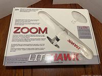 Closed box showing LiteHawk Zoom branding and airplane image with product details on the lid.