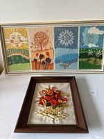 Two framed vintage handmade needlepoint artworks: Four seasons wall hanging and flower basket wall art.