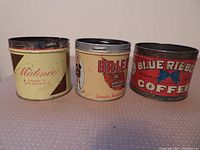 Three antique tins including Matinee tobacco tin, Brier Virginia tobacco tin, and Blue Ribbon vacuum coffee tin viewed from front