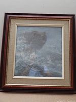 Framed print showing entire artwork with wooden reddish-brown frame and beige matting.