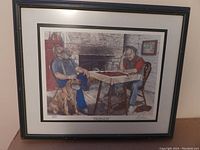 Framed print showing two men and a dog in an indoor setting by Albert Casson.