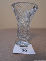 Front view of the pinwheel crystal vase showing the cut design, flared opening, and sturdy base.