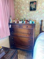 Front view of Gibbard wood dresser with four drawers and wooden knobs, showing carved beading and turned legs.