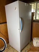 Front-right exterior view showing overall shape, door, and handle