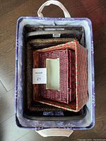 Top view of the fabric lined basket containing the other four baskets packed inside