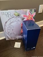 Photo of two boxed items: Studio Nova crystal tray with floral design and Mikasa Elite blue box for vase