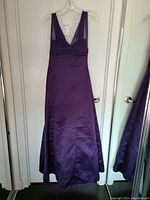 Front view of the purple sleeveless bridal dress with deep V-neck and pleated bust detail