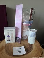 Cuccio Naturale Calm Kit box, Himalayan pink salt rocks in Ziploc bag, incense sticks in pink box, Smooth Sister aromatherapy powder container all displayed on a wooden slab.