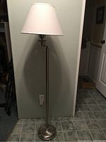 Full view of the OTT-LITE floor lamp standing at 61 inches tall, with white fabric shade attached to metal pedestal base.