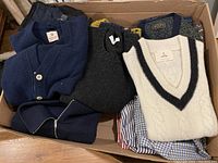Box view showing folded sweaters and shirts