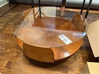 Front angle showing glass top and wood base