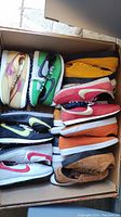 Box containing twelve pairs of assorted Nike sneakers
