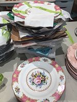 Stack of plates showing quantity and green tape label