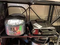 Overview of Zojirushi multi-cooker and T-Fal grill on shelf