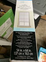 Photo of the new in box Mainstays cordless vinyl mini blind showing front of packaging with size and product details.