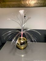 LED Rotating Fountain Light powered off showing fiber optics and gold spherical base.