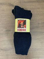 Photo of a pair of Kodiak winter socks in original packaging showing brand label with bear image