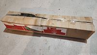Original packaging of 6 foot Sierra Fir artificial Christmas tree, box is worn and taped.