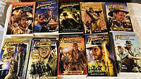 Photo showing ten paperback Indiana Jones books in a two row layout, titles and covers visible.