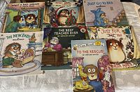 Photo of eight assorted Mercer Mayer children’s books arranged on a towel, showing front covers featuring Little Critter character in various scenarios.