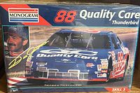 Box of a sealed Monogram 1:24 scale Quality Care #88 Thunderbird model car kit showing the front with image of the blue and white race car and driver photograph and signature.