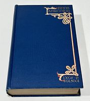 Front cover showing blue cloth binding with gilt title and decorative flourishes