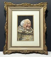 Full view of the framed watercolour painting showing the smiling old man; frame with ornate gold carving and cream accents