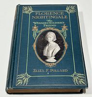 Image of the book's front cover showing blue cloth binding, gold embossed title text, and central bust illustration of Florence Nightingale.
