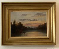 Full front view of framed landscape painting showing scene and frame details