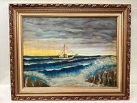 Framed oil painting of a boat on a rough sea under a cloudy sky, showing the entire artwork and frame.