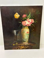 Full view of the still life oil painting showing the vase with flowers and goblet on a wooden table against a dark background.