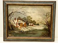 Full view of the framed oil painting showing snow-covered houses near a pond in a winter landscape.