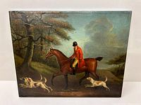 Full front view of the framed oil painting showing rider, horse and hounds