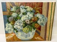 Full view of the oil painting showing the floral arrangement in a vase, signed Goode in the lower right corner.