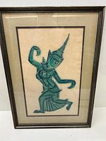 Framed South Asian woodblock print showing full artwork with figure in traditional attire posed dynamically.