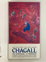 Full frontal photograph of the advertising poster showing the entire artwork and text in the lower panel.