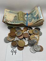 Stack of Brazilian banknotes with various denominations visible including 5,000 Cruzeiros