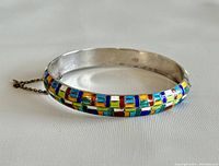 Silver 925 marked bangle with multicolor inlay and safety chain.