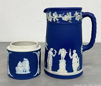 Blue Jasperware pitcher and bowl, showing classical white relief decorations and twisted handle on pitcher