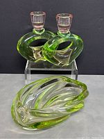 Front view of the two green glass Art Deco candlestick holders with pink glass candle cups and the green and clear swirled glass bowl.