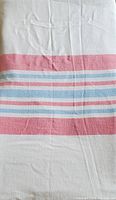Photo showing the red and blue horizontal striped pattern on white cotton flannel fabric.