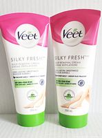 Front view of two tubes of Veet Silky Fresh Hair Removal Cream for dry skin, 200 ml each, showing brand and product details.