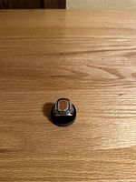 Front view of the replica ring showing the orange and black San Francisco Giants logo and surrounding clear stones.