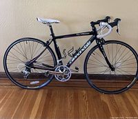 Full side profile of Cannondale Synapse Ultra C4 road bicycle showing frame, wheels, handlebar, saddle and bottle cages