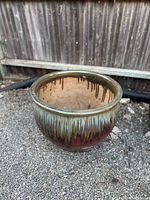 Front angle showing the pot's glazed drip effect with multicolor finish and wide opening