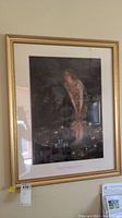Full view of larger framed Midsummer Eve print under glass with gold-tone frame hung on wall.