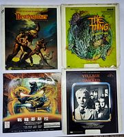 Four LaserDisc covers displayed: Deathstalker, The Thing, Godzilla, and Village of the Damned.
